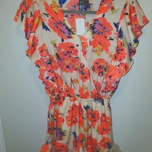 Amazingly cute romper with ruffle detail.